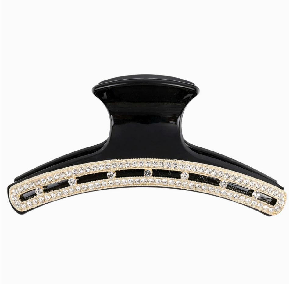 Close-up of rhinestone detail on black hair claw clip