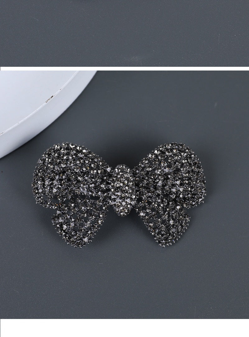 Blue rhinestone bow hair clip detail