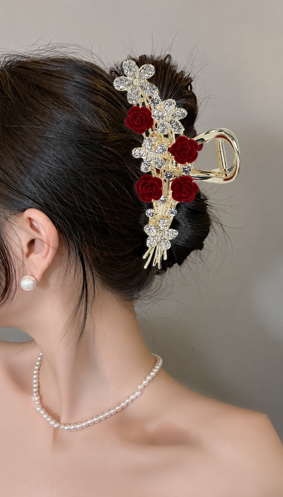 Statement A382 red rose and gold-tone floral hair claw worn in an updo. AI-assisted supplier styling image.