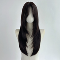 Black layered straight synthetic wig with curtain bangs shown on a headstand, front view