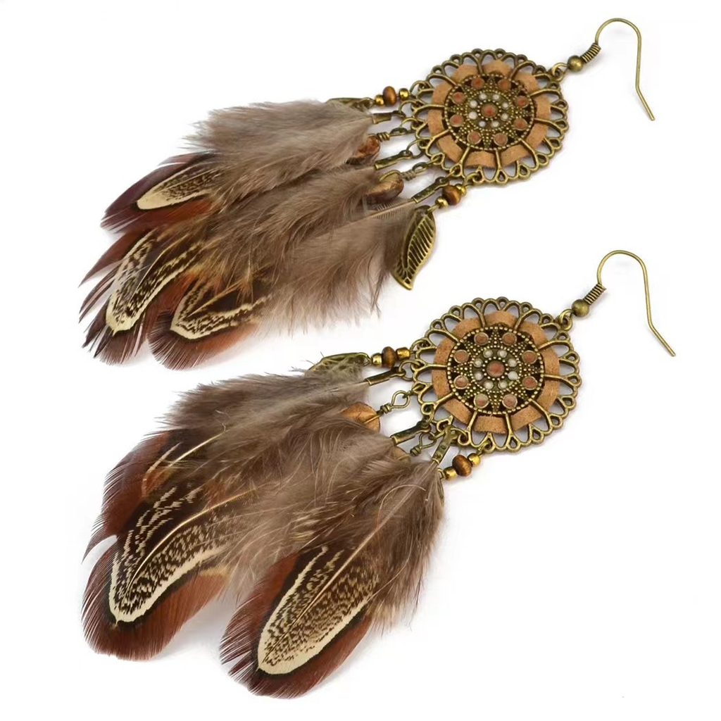 Brown feather earrings showing floral medallions, decorative beads and leaf-shaped charms