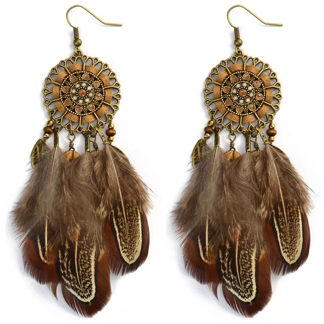 Pair of brown feather earrings with bronze-tone floral medallions