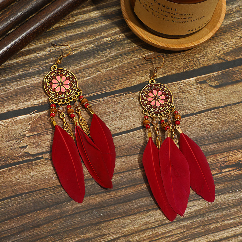 Pair of burgundy floral medallion feather earrings