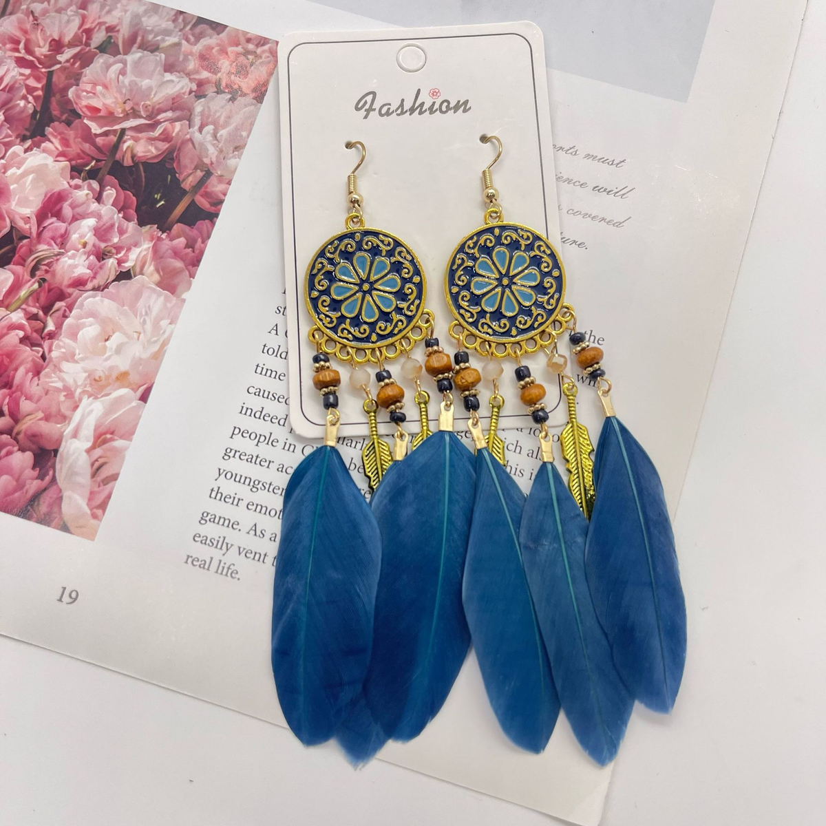 Pair of navy blue floral medallion feather earrings