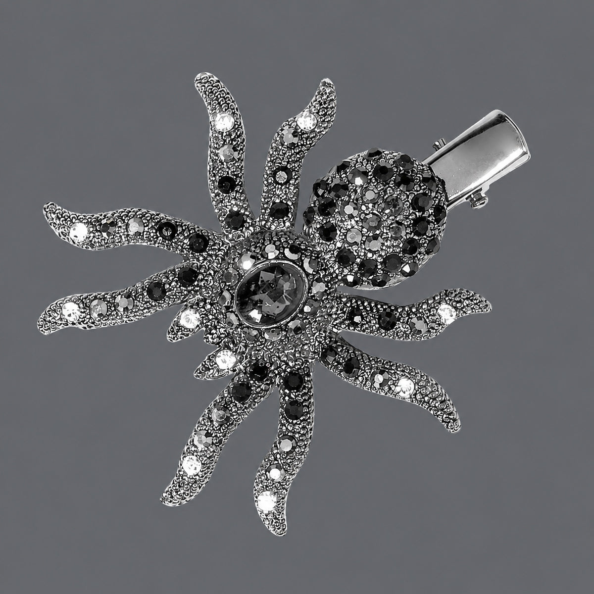 Faceted Rhinestone Spider Hair Clip on a gray background