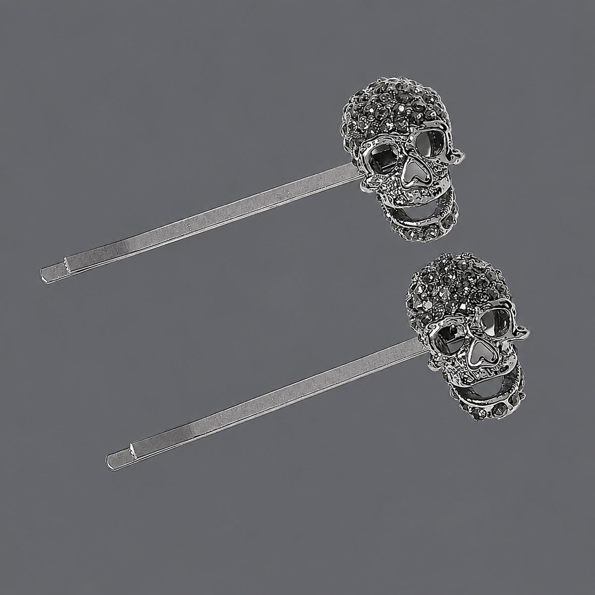 Black Rhinestone Skull Hair Pins - Set of 2 on a gray background
