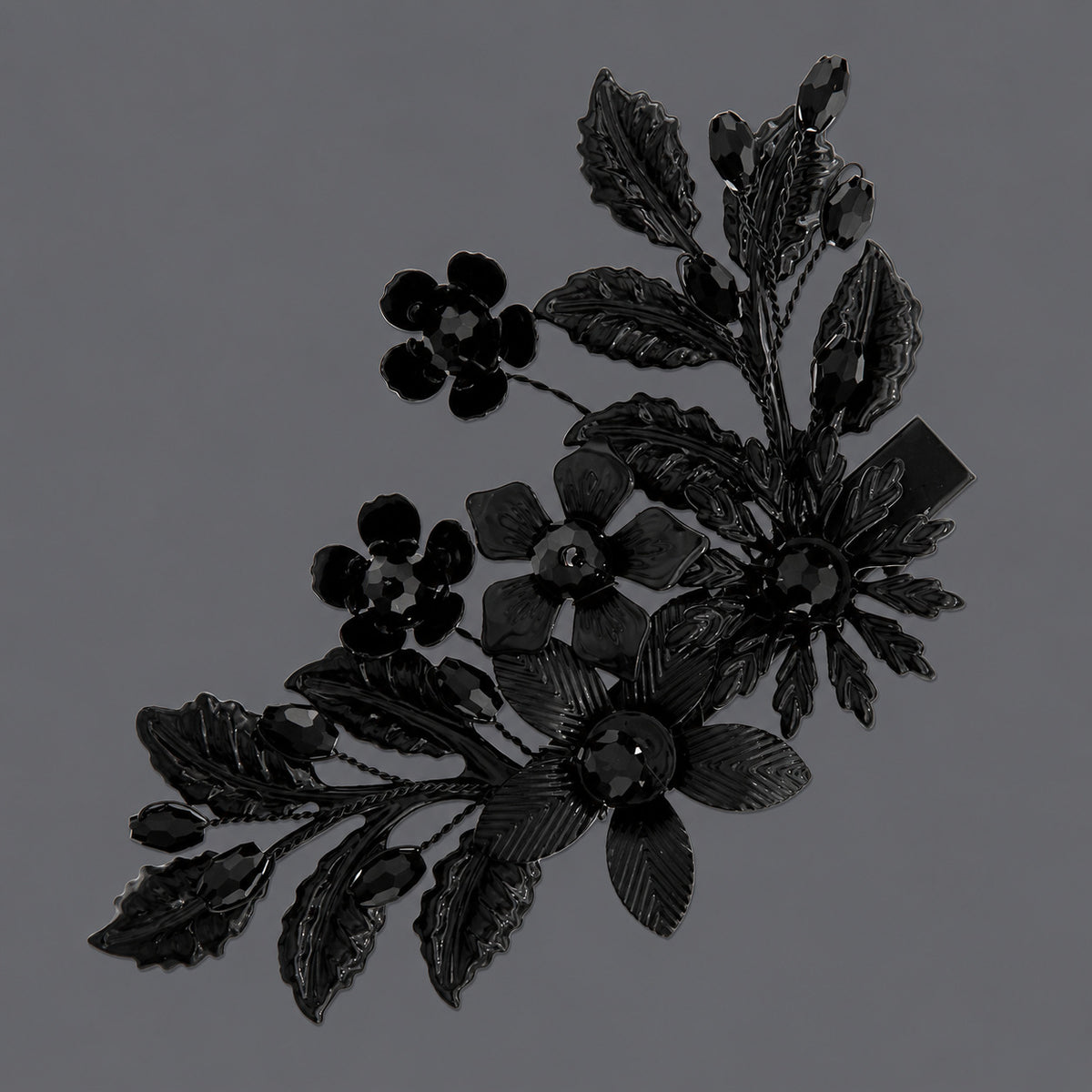 Black Floral Branch Rhinestone Hair Clip on a gray background