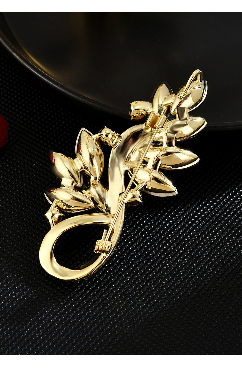 Blue crystal leaf brooch detail