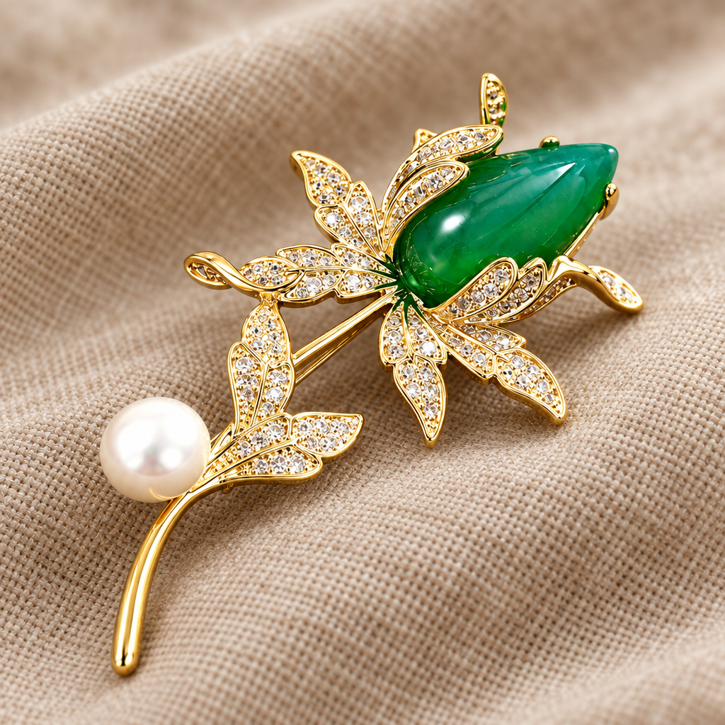 Close-up of green magnolia brooch with freshwater pearl