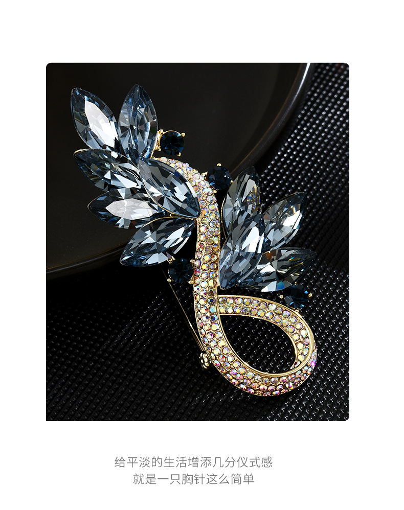 Blue crystal leaf brooch detail