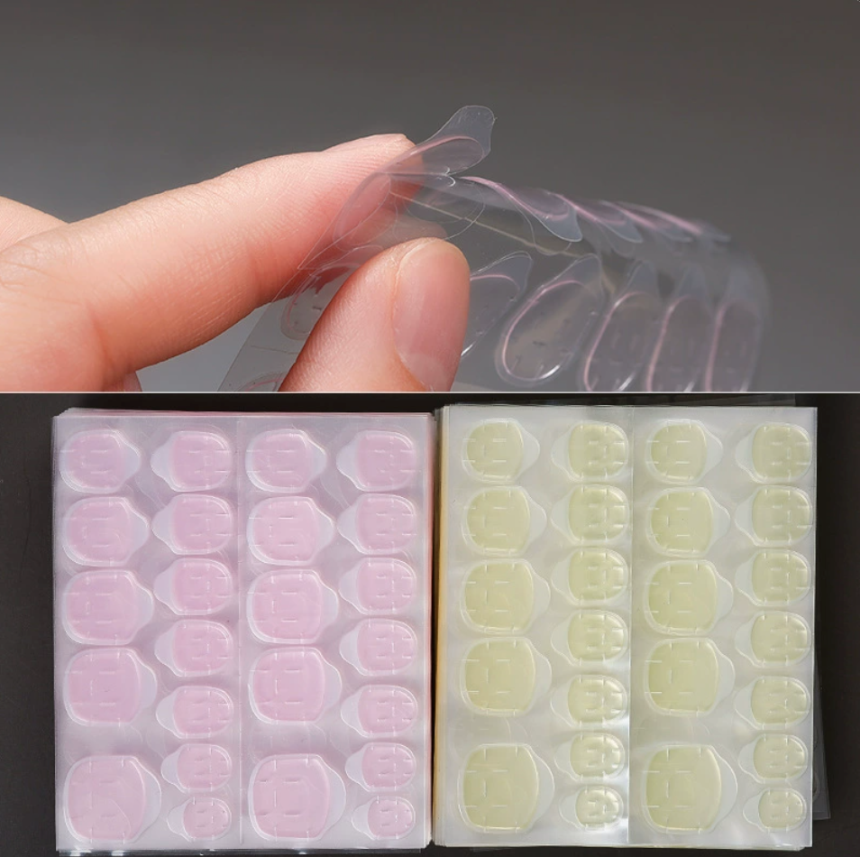 Hand wearing press-on nails applied with waterproof jelly adhesive tabs