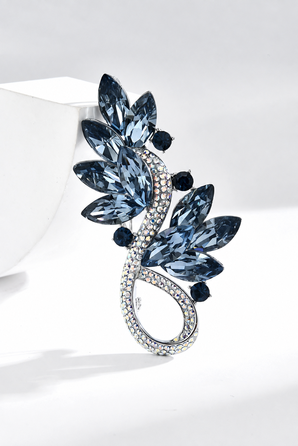 Silver-tone blue crystal leaf brooch with a rhinestone loop