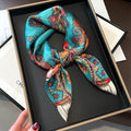 Turquoise Paisley printed square scarf, tied in a loose knot; design Z2-19301