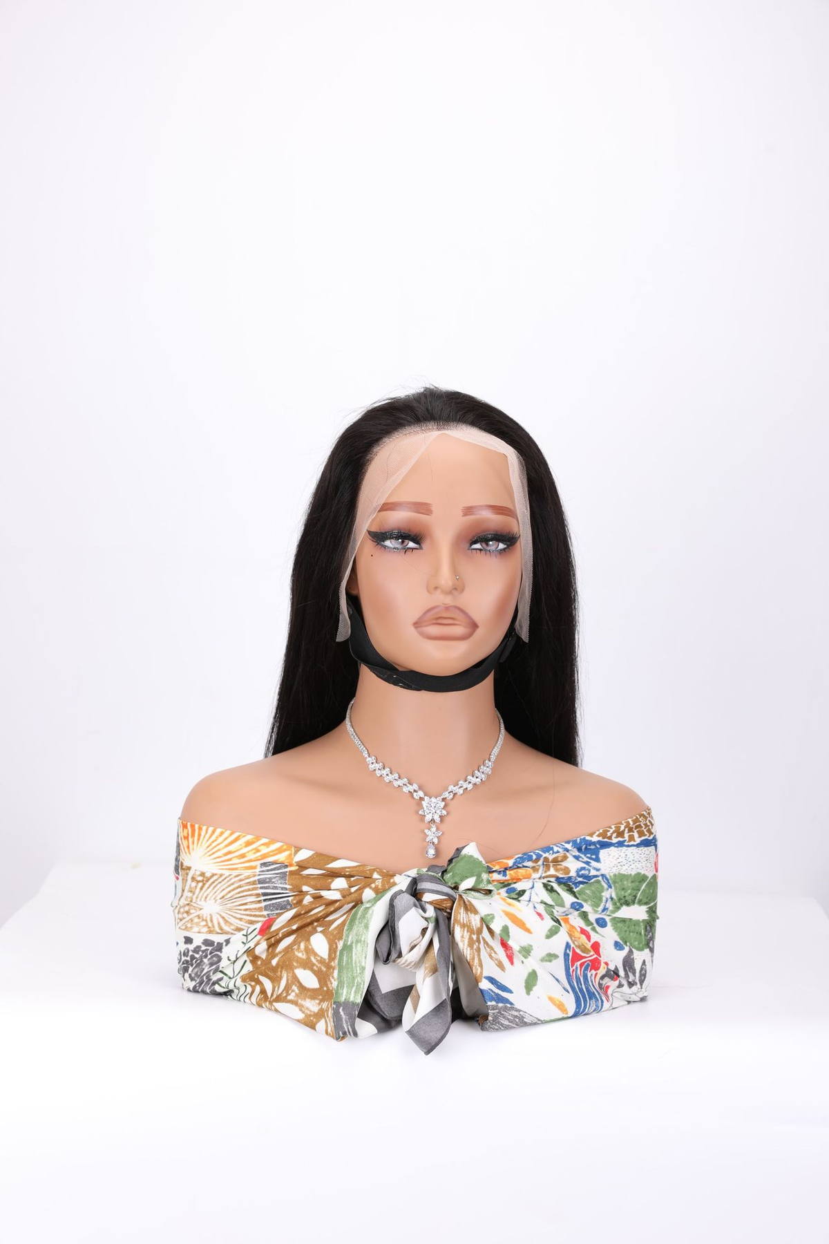 Front view of a 1B black human hair bob wig with uncut lace on a mannequin