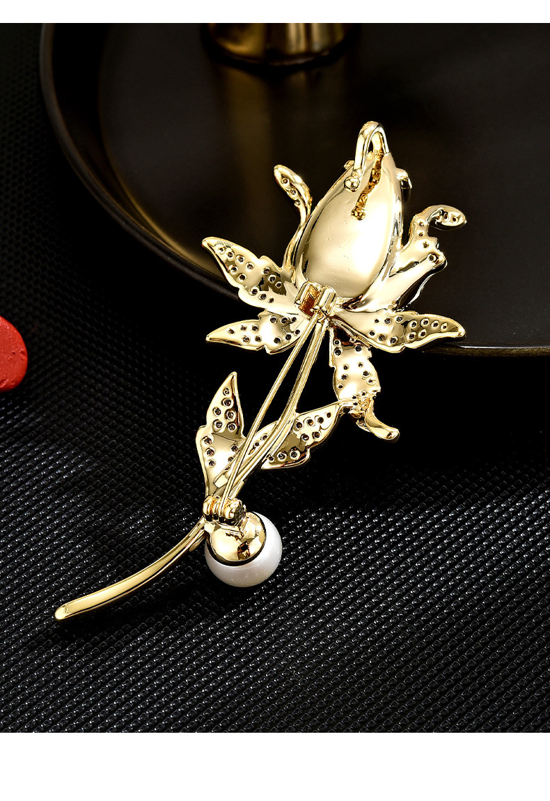 Back of the gold-tone magnolia brooch showing the pin and clasp