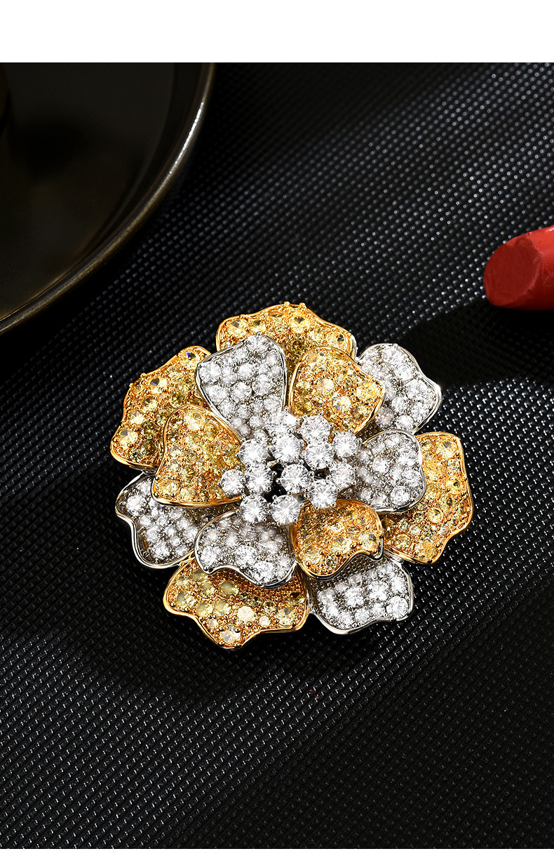 Gold-tone and silver-tone peony brooch with layered petals and clear and yellow decorative stones