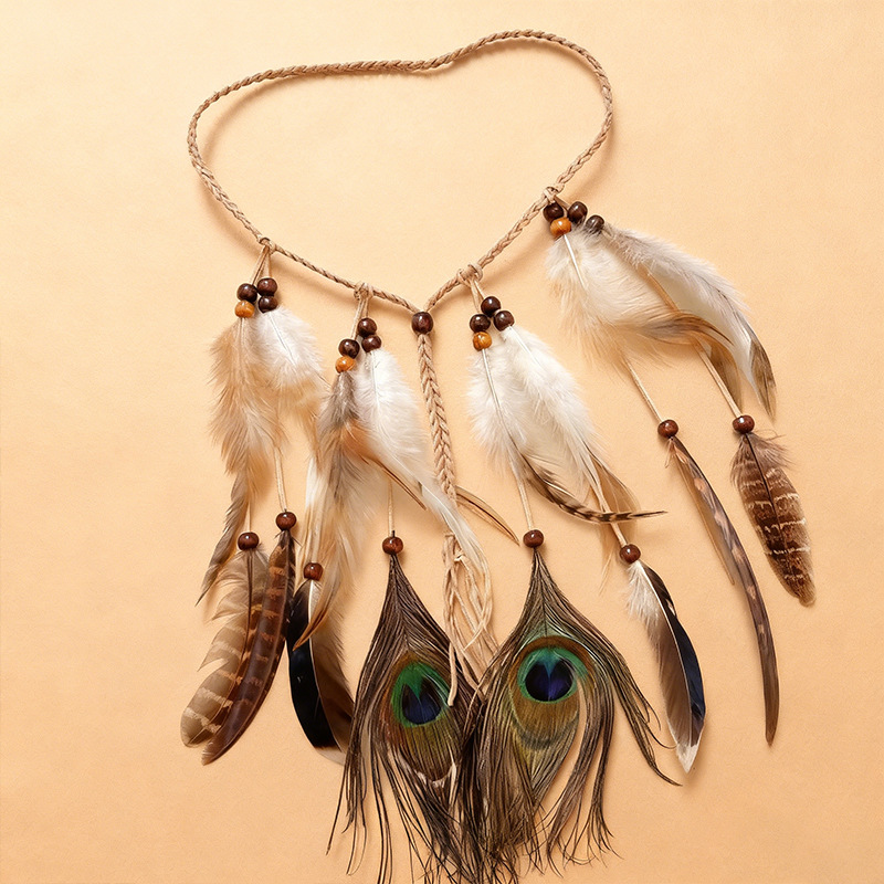 Front view of a bohemian feather tassel headband with brown beads