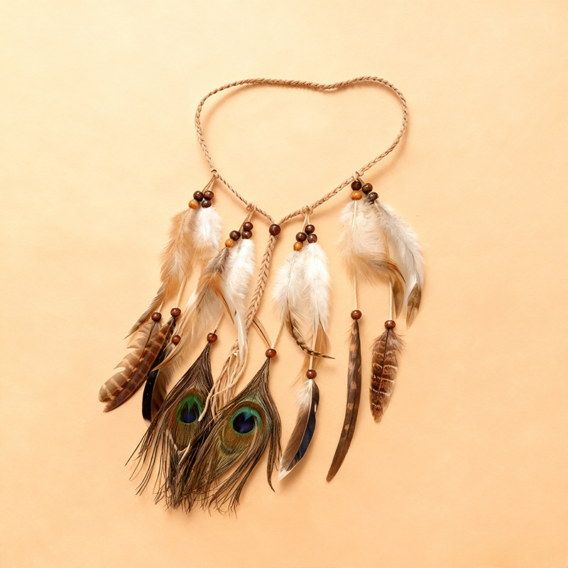 Brown and cream feather tassel headband with a tan braided band and blue-green accents