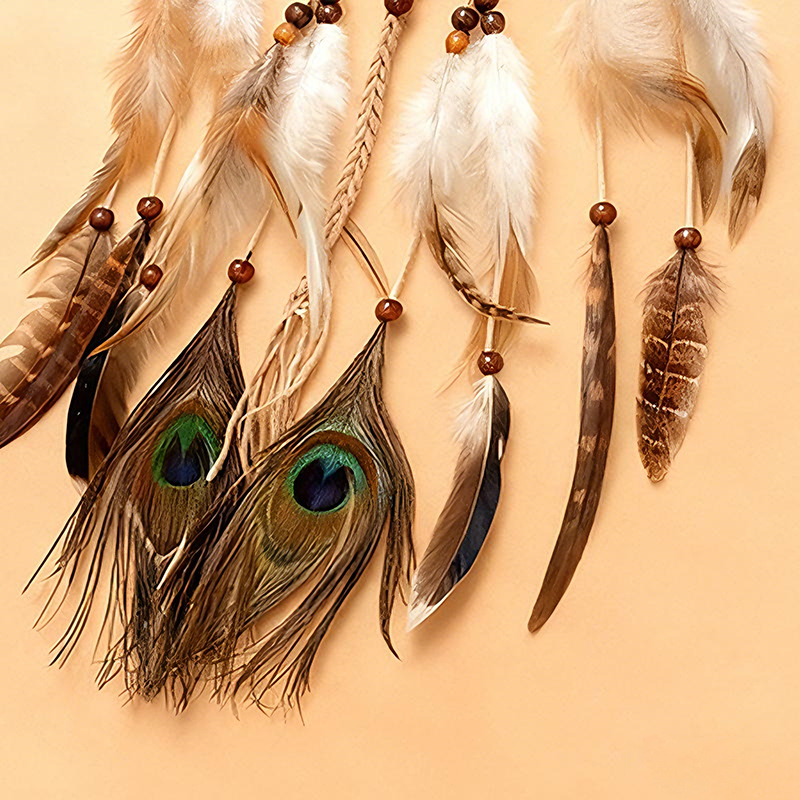 Close-up of brown and cream feather tassels with blue-green eye-pattern accents