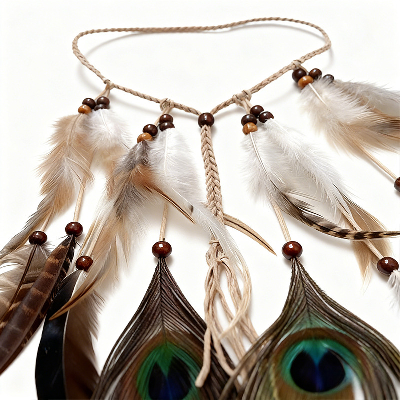 Braided feather headband and brown beaded tassels on a white background
