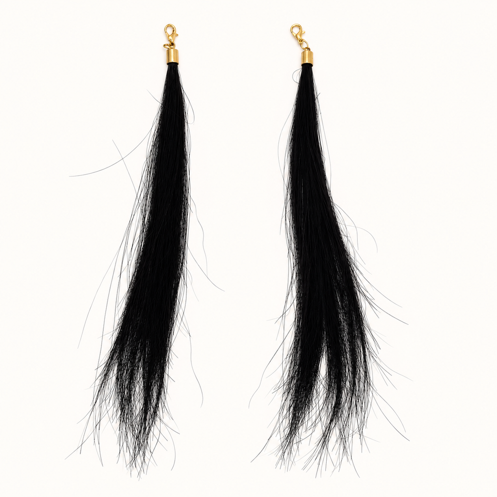 Pair of Black human hair charms with gold-tone lobster clasps, approximately 18 cm hair length.