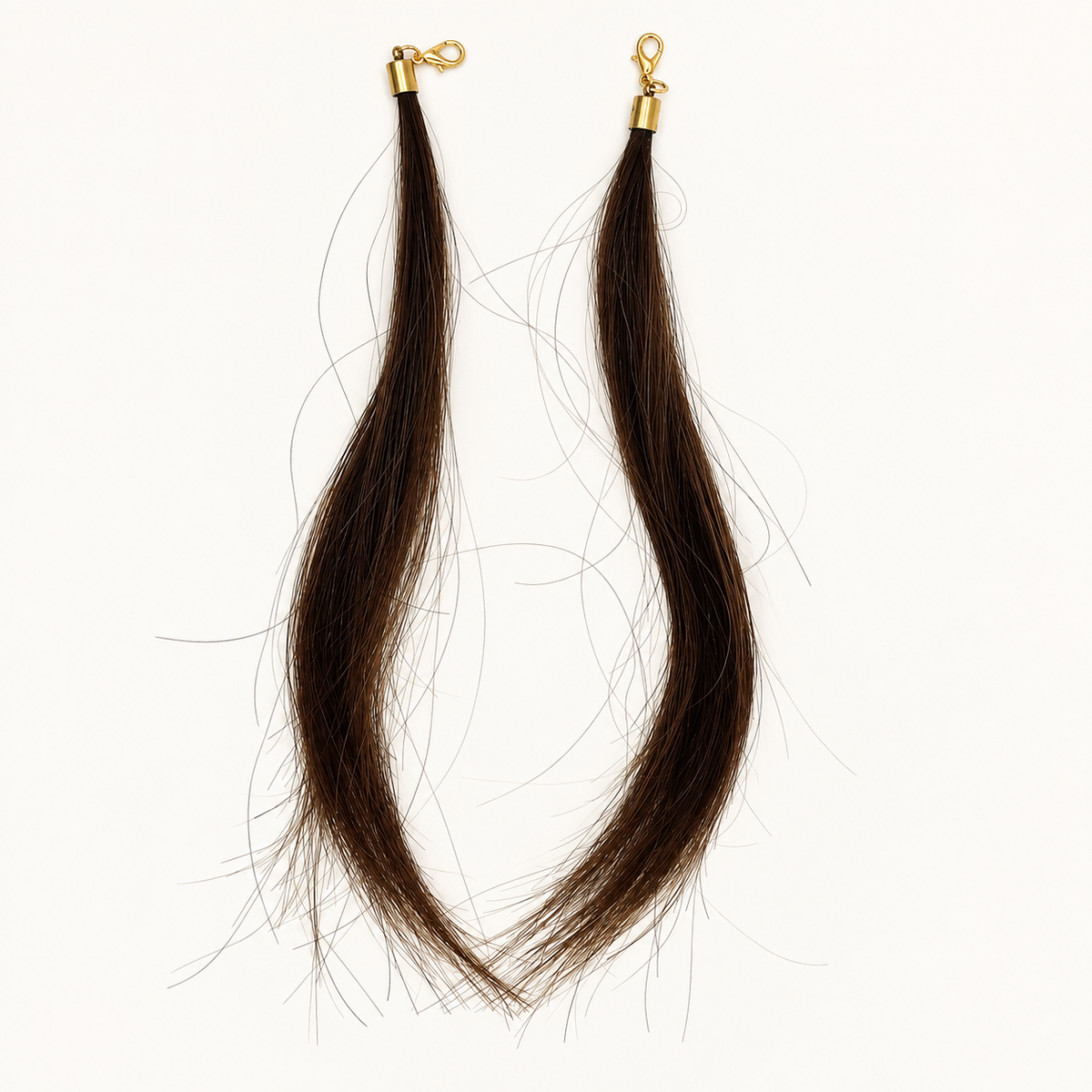 Pair of Brown human hair charms with gold-tone lobster clasps, approximately 18 cm hair length.