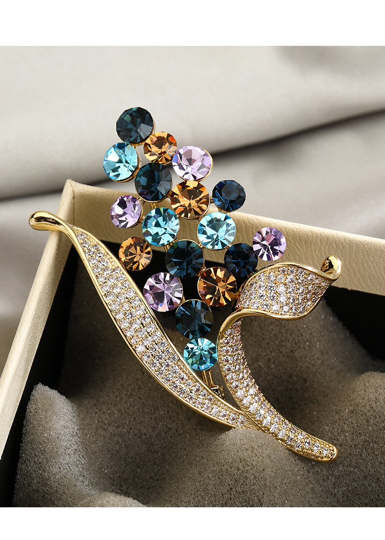 Full view of the floral bouquet brooch with blue amber and lavender stones