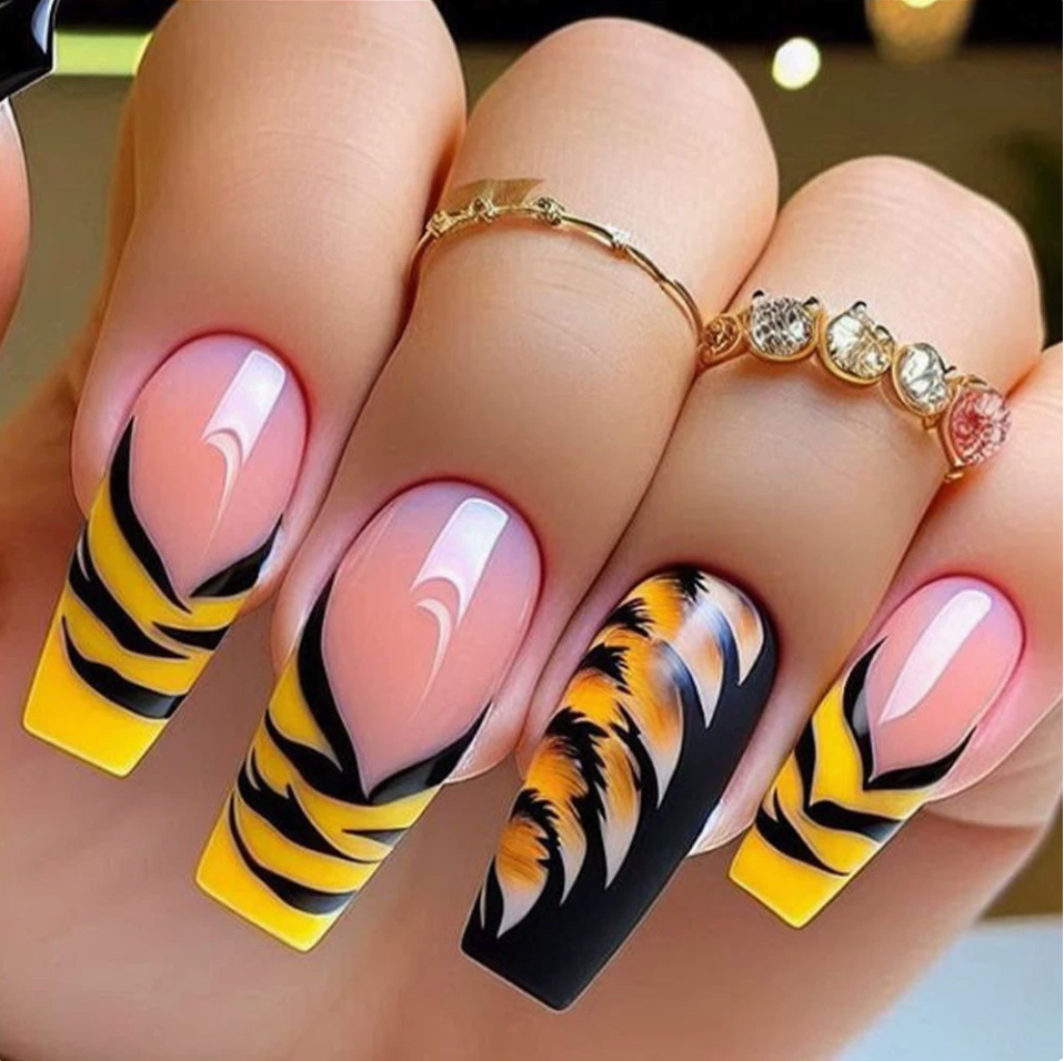 Yellow and black striped French-tip press-on nails with a pink nude base, style Y392
