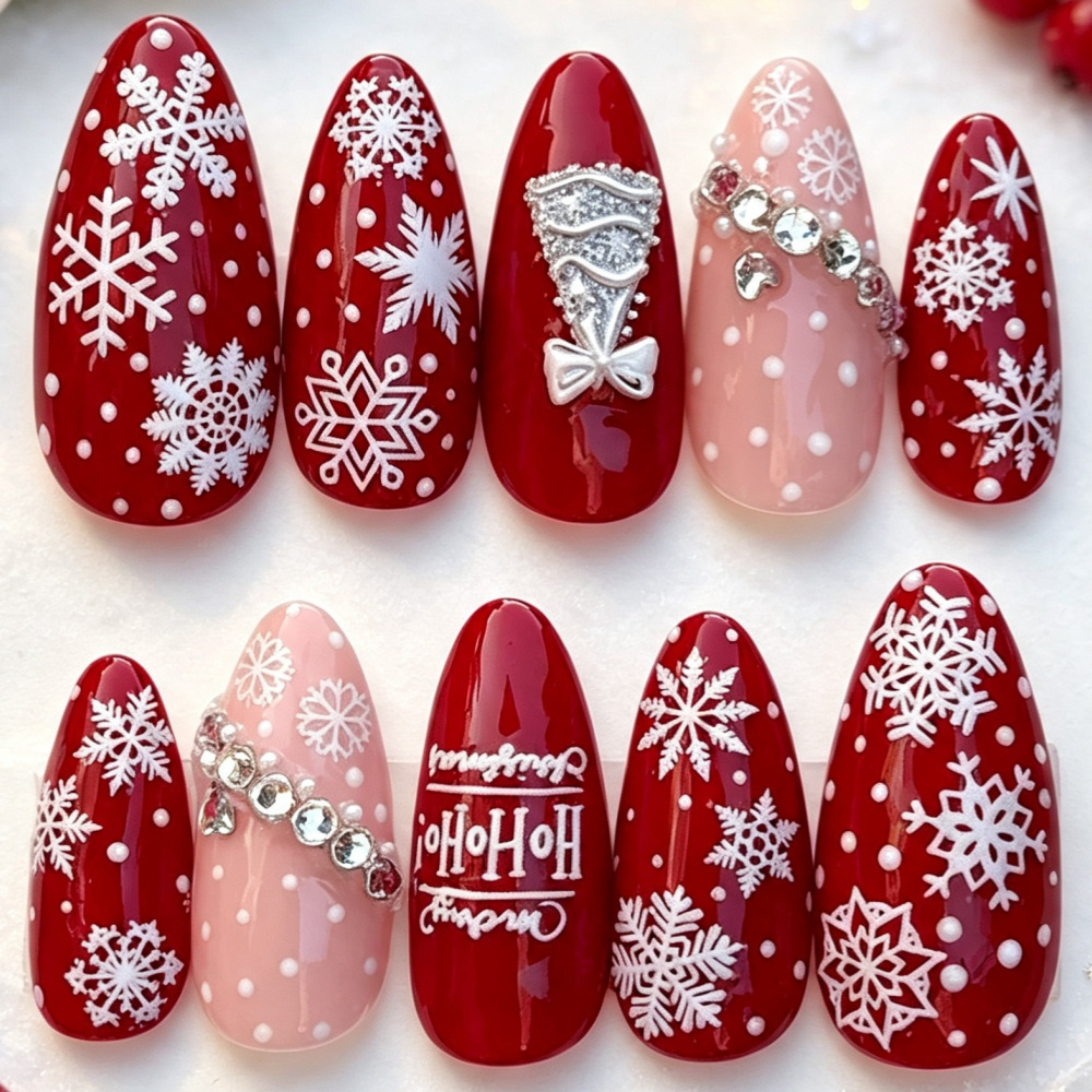 Burgundy and blush long almond Christmas press-on nails with white snowflakes and jewel-look accents, style Z617