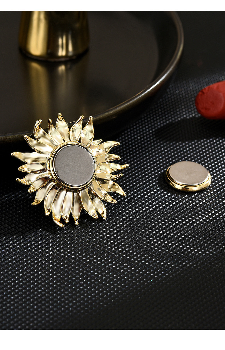 Back of the gold-tone sunflower brooch with its removable round magnetic fastener