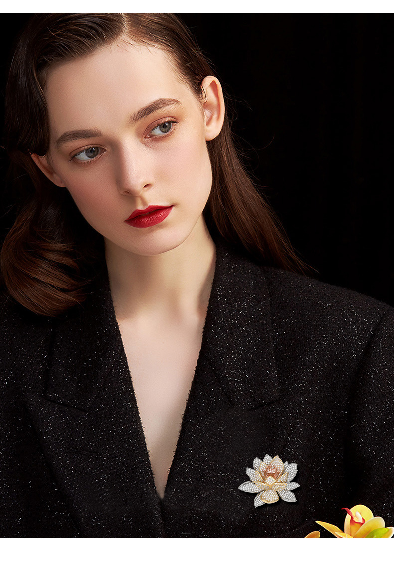Tri-tone lotus brooch styled on a black jacket