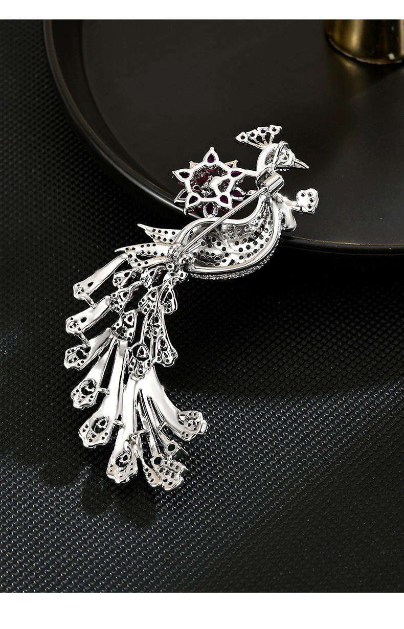 Back of the peacock brooch showing the rear pin and openwork feather construction