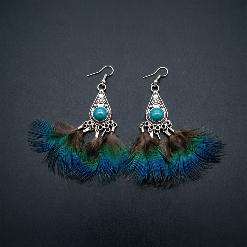 Peacock feather earrings showing feather spread and fishhook ear wires