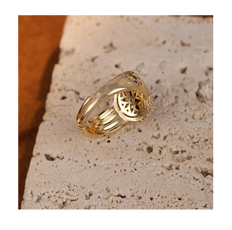 Back view showing the ring's open adjustable band and setting