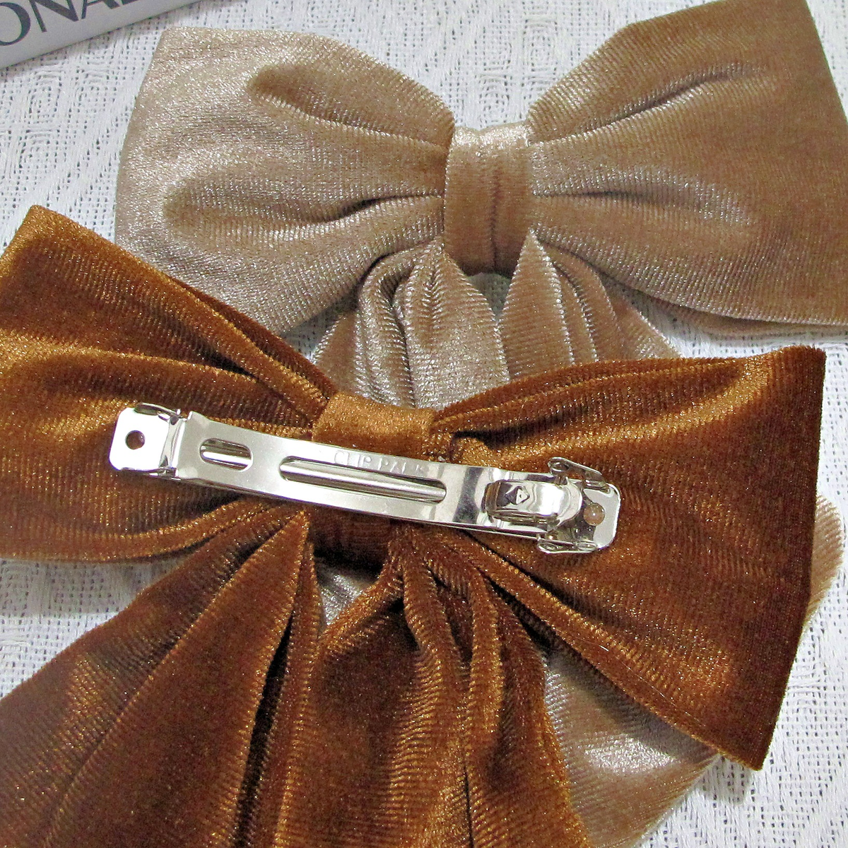 Back of the velvet bow barrette showing its metal spring clasp