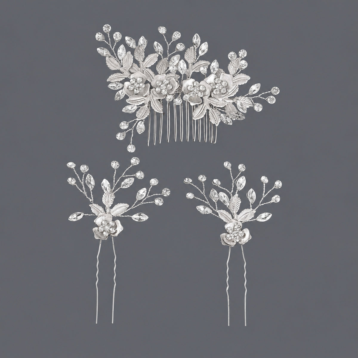 Silver-tone floral three-piece set with one rhinestone comb and two hair pins